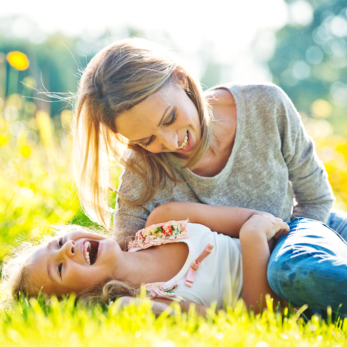 Woman playing with child
