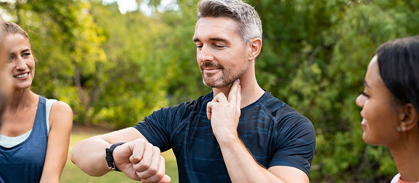 Man checking his pulse during exercise