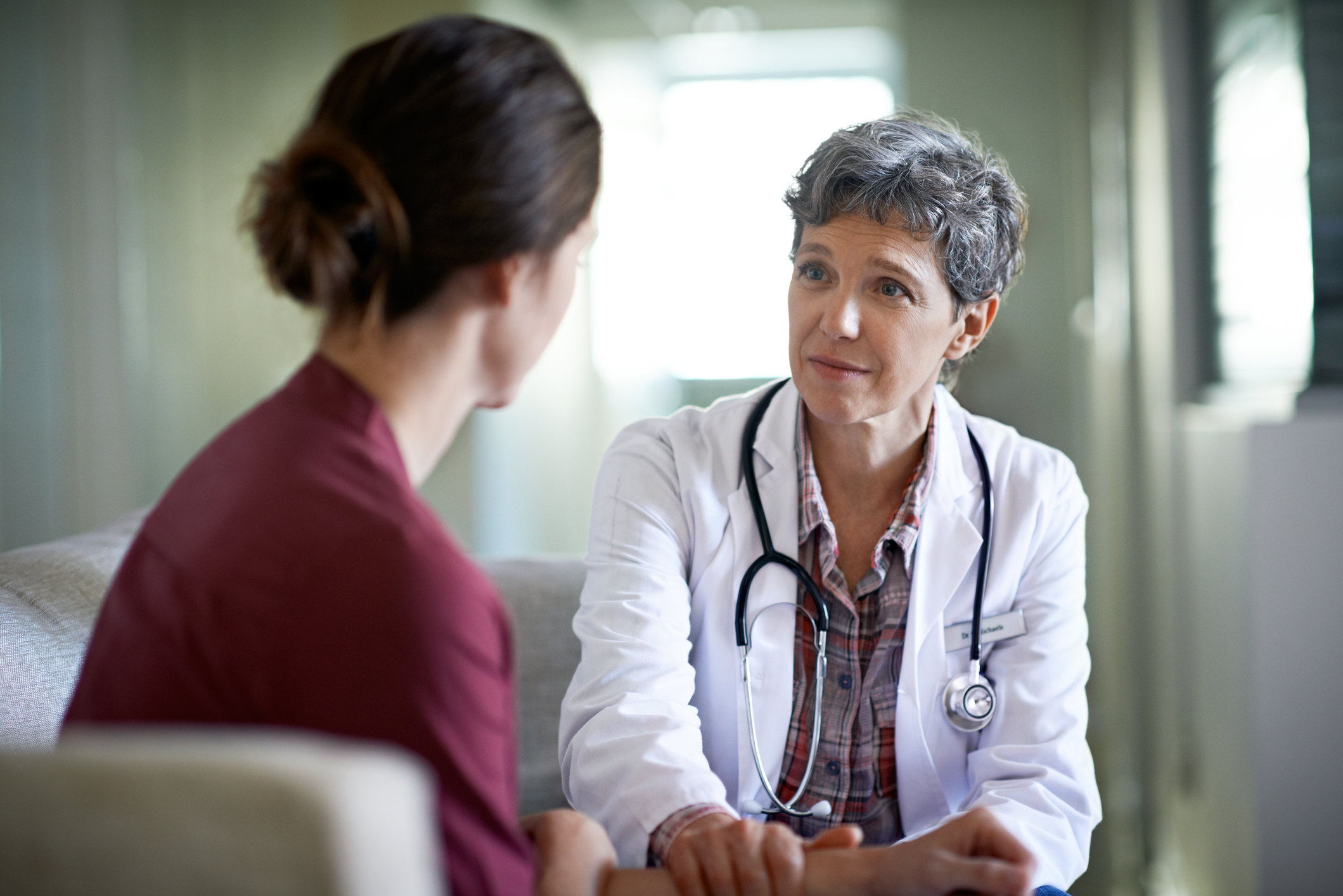 Doctor and patient having serious health conversation