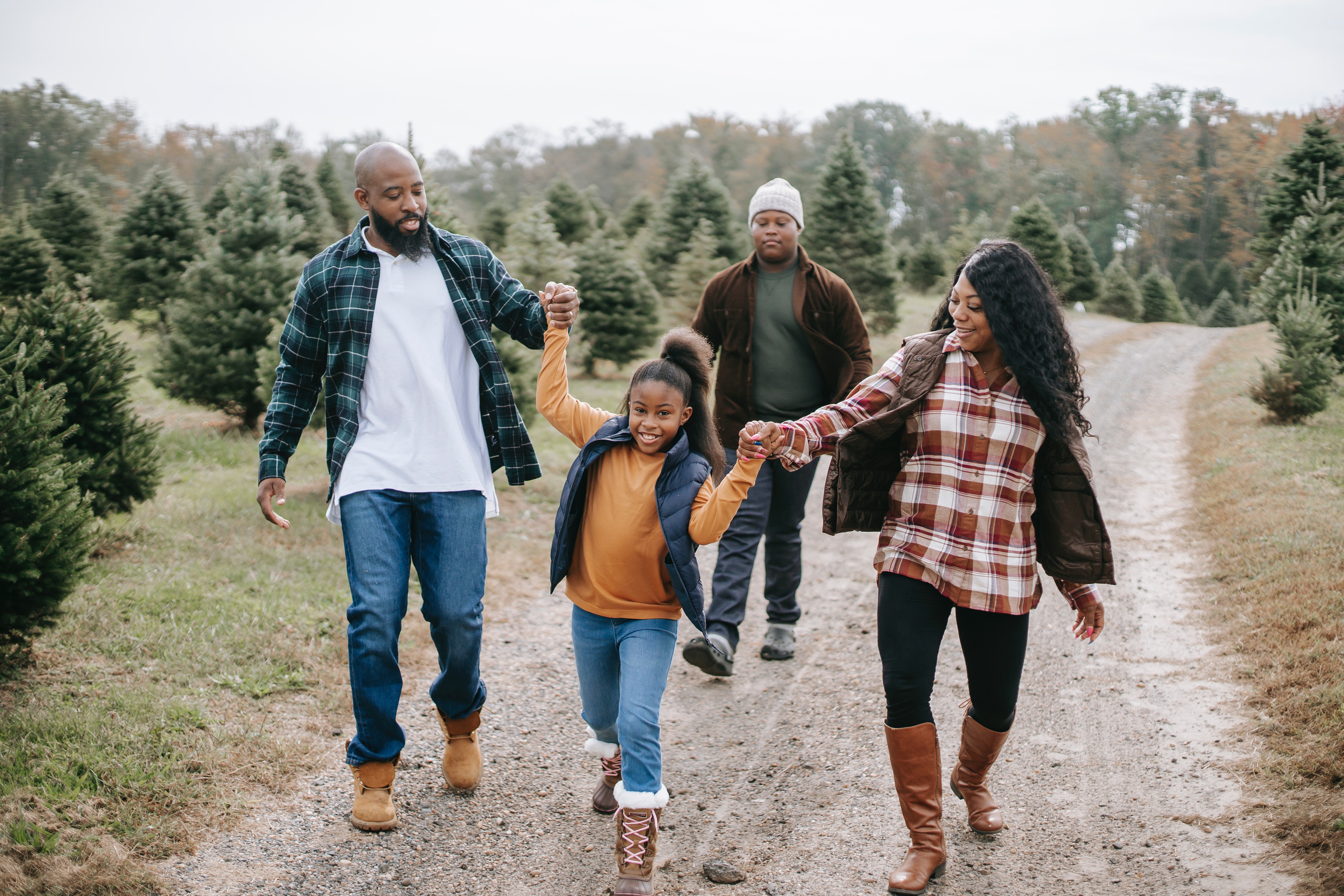 family outside_holiday flannel vermont.jpg Family walking outside during the holiday season