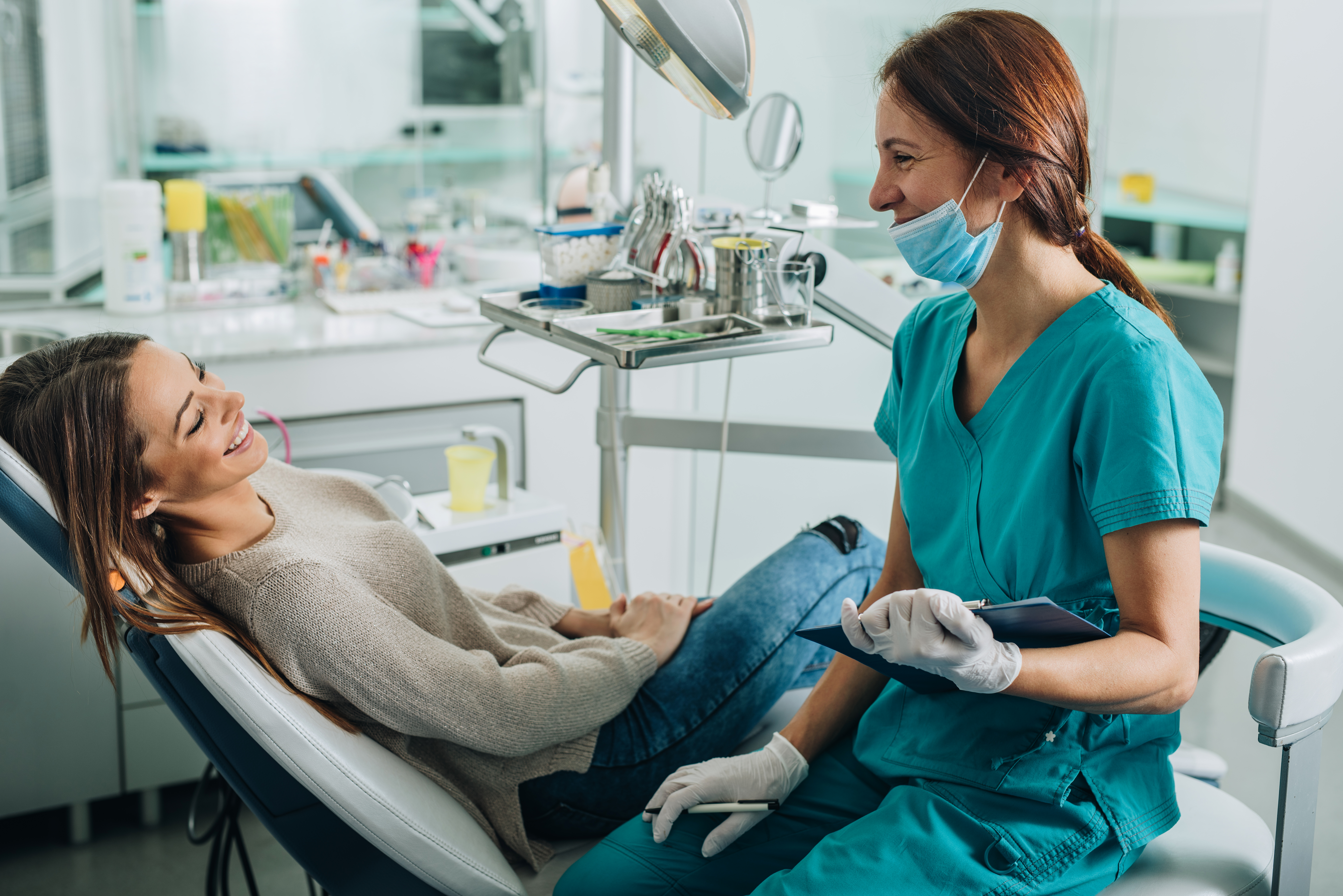 DentalCare.jpg Dental hygienist talking with patient