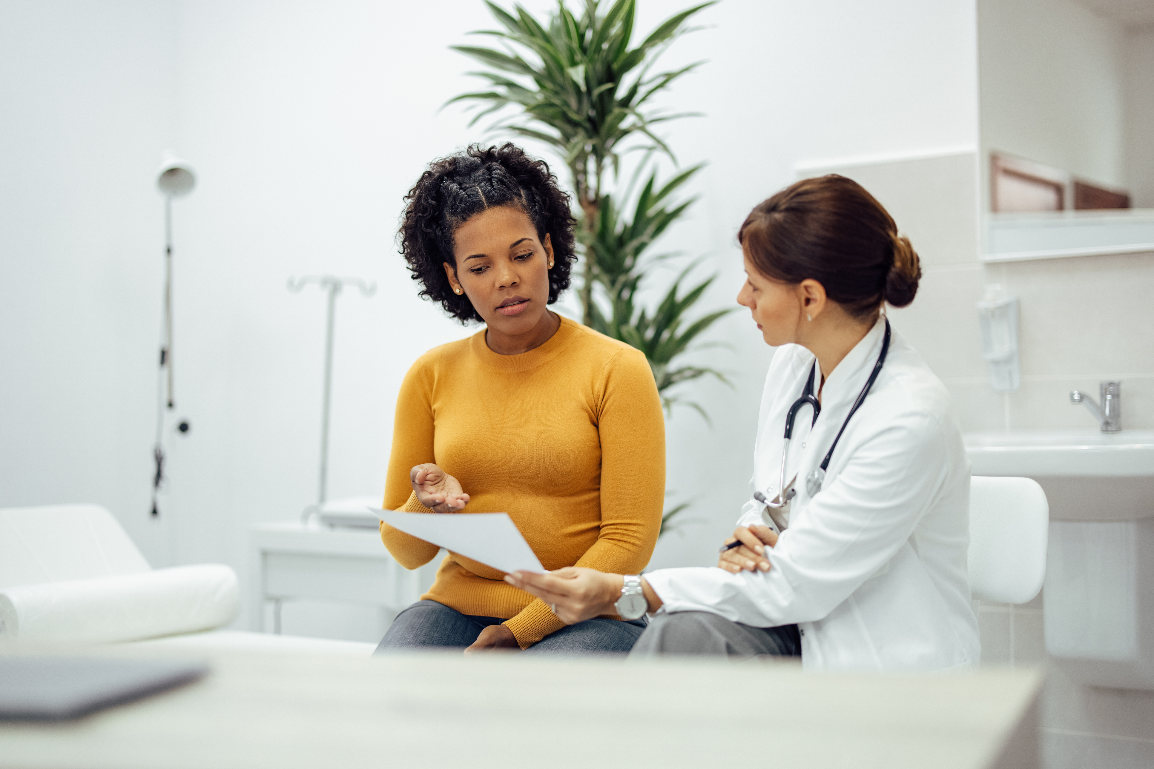 Patient and doctor.jpg Patient and doctor discussing test results.jpg