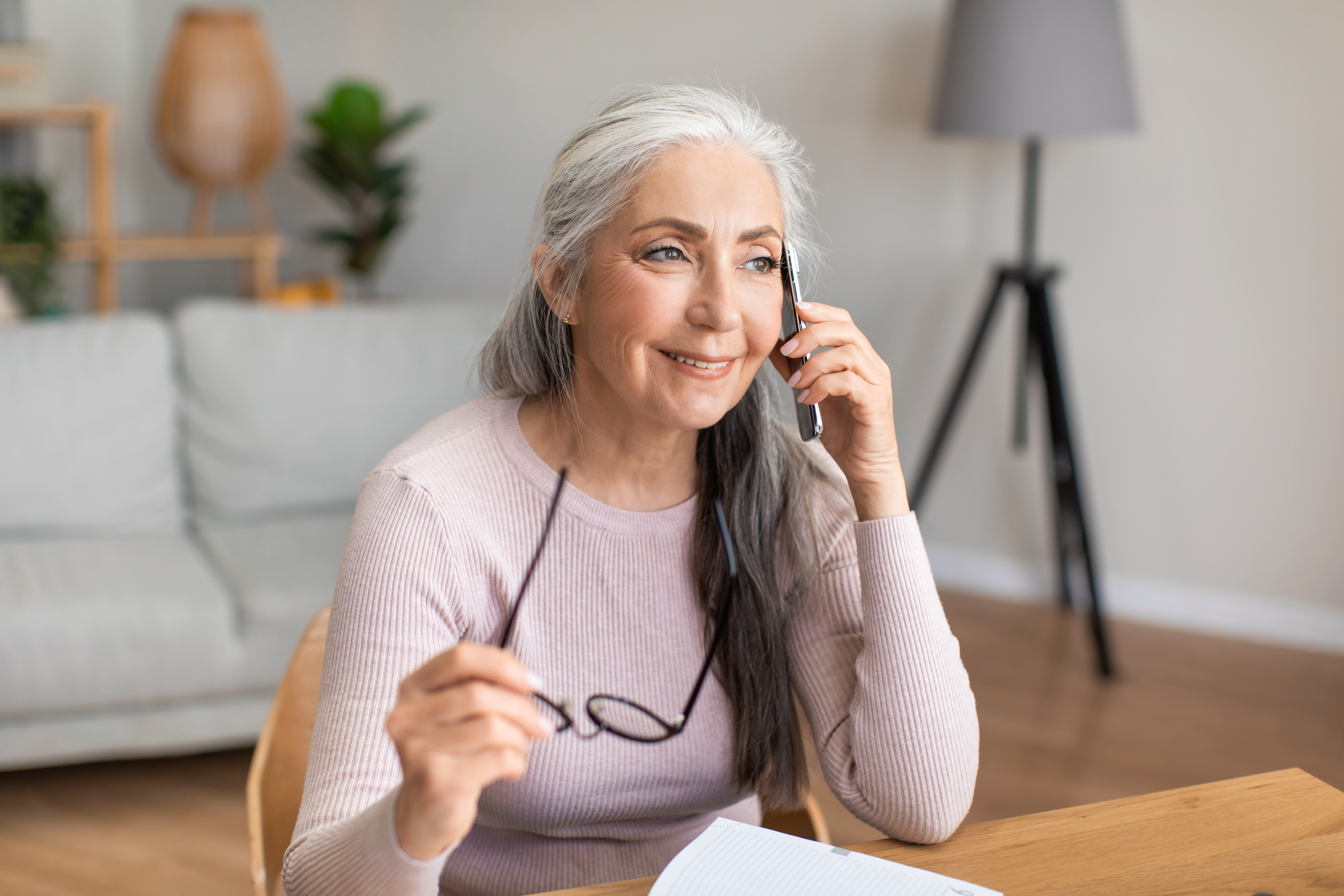 Senior woman calling customer service case management phone