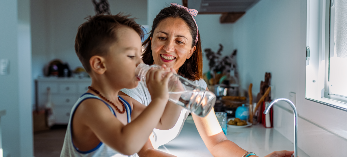 Woman and Child Drinking Water