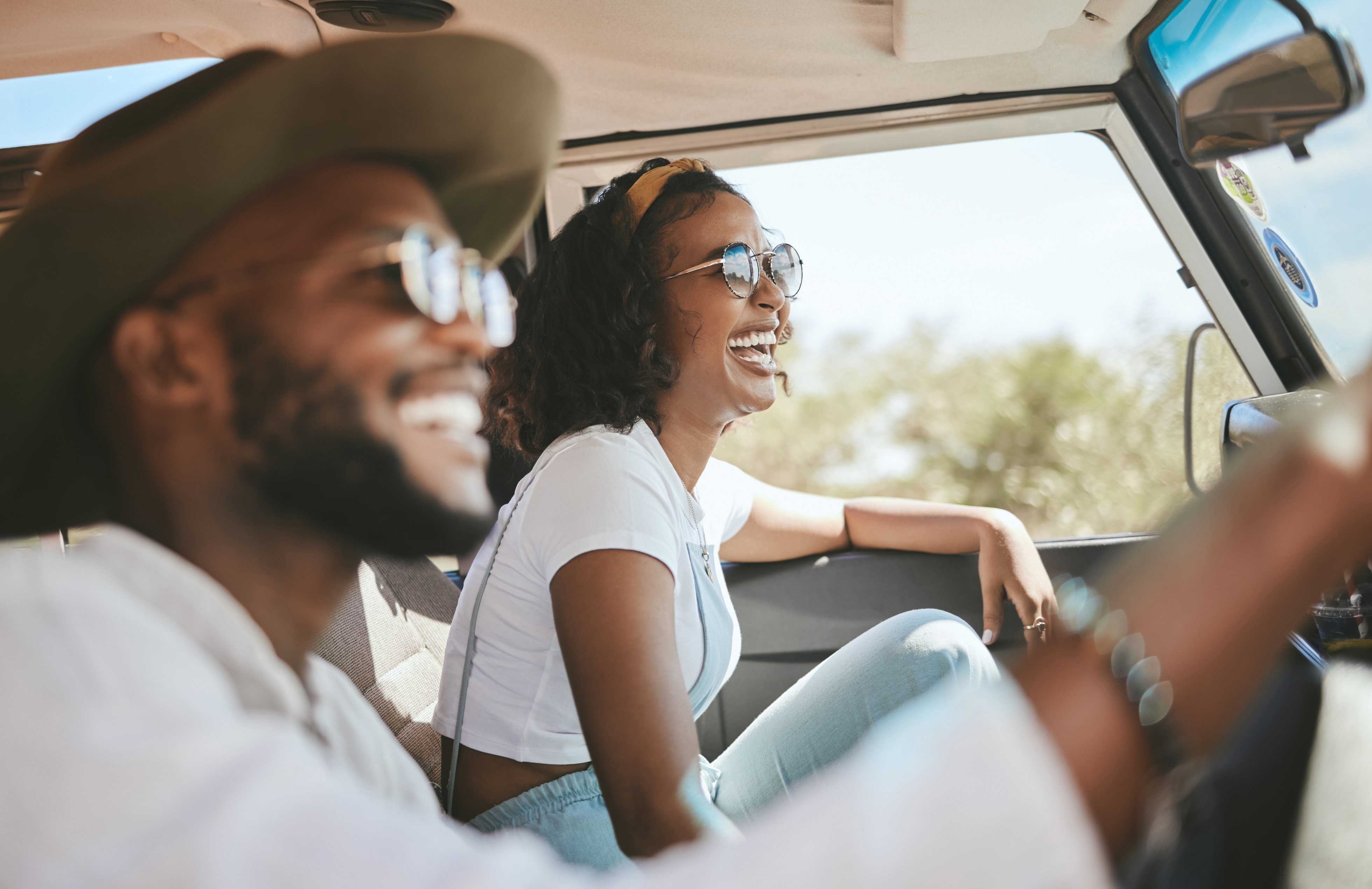 Couple driving with sunglasses