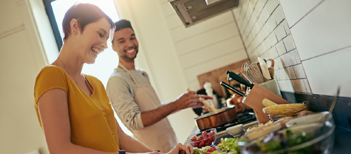 Couple preparing healthy food in the kitchen