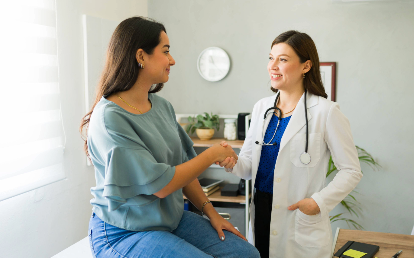 patient shaking hands with her new doctor
