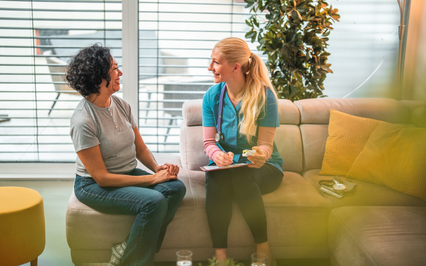 woman sitting with doctor for appointment