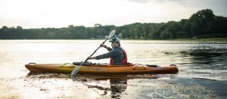Man kayaking on a lake