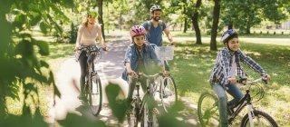 Family biking on path