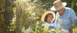 Grandmother in the garden with grandchild