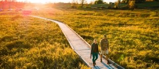 a couple walking on boardwalk of Vermont