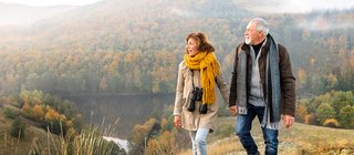 Man and woman walking on a mountian