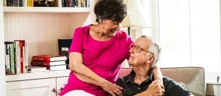 elderly couple sitting together