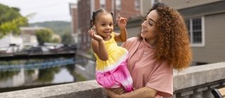 Mother and daughter outside in a Vermont town