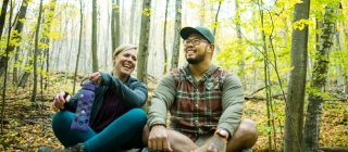 couple hiking in the woods of Vermont