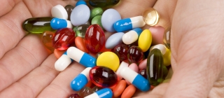 Pharmacist hold medication pills