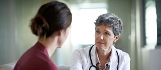 Doctor and patient having serious health conversation