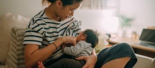 Woman breastfeeding child