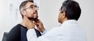 Male patient at check up with his doctor