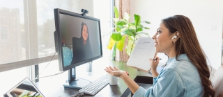 Woman on a telehealth call on her computer