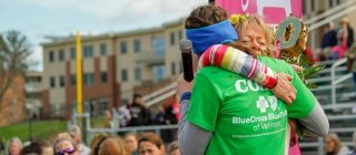 GOTRVT Leaders embracing at a 5K event 