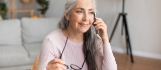 Senior woman calling customer service case management phone