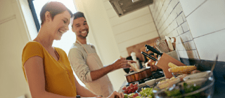 Couple preparing healthy food in the kitchen