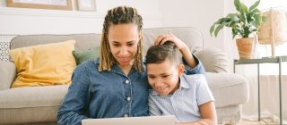 Mother and son looking at a computer