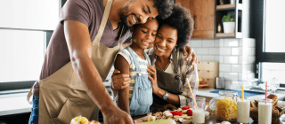 family cooking a healthy meal together