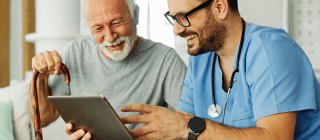 provider and patient reviewing a tablet
