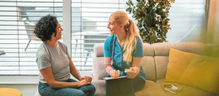 woman sitting with doctor for appointment
