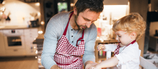 dad baking cookies with his child