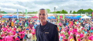 Don George poses in front of a crowd at a GOTRVT event