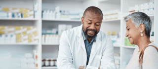 Pharmacist talks with a customer