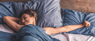 woman stretching after sleeping