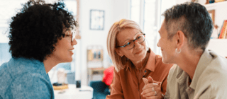 three women having a deep conversation 