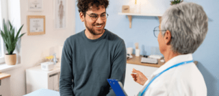 young man in 20s at his annual wellness exam