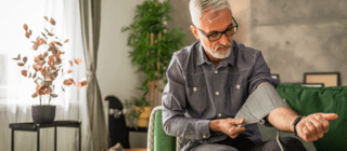 man testing his blood pressure