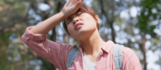 woman overheating while hiking
