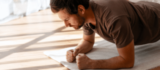 man doing plank at home