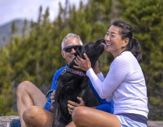 Couple hiking in Vermont with their dog
