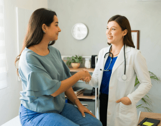 patient shaking hands with her new doctor