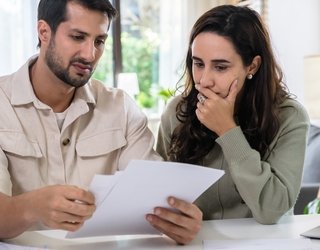 Couple looking at healthcare bill
