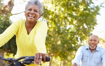 elderly couple biking