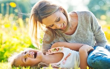 Woman and child laughing