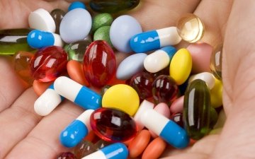 Pharmacist hold medication pills