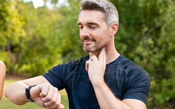 Man checking his pulse during exercise
