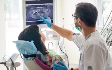 Dentist with patient during dental exam