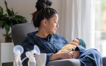 Woman breastfeeding with pump